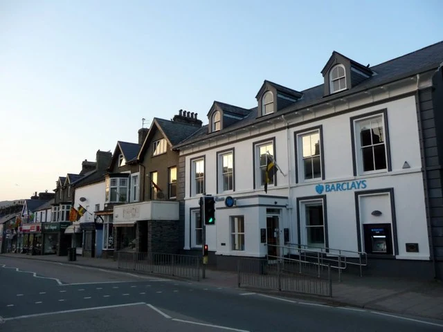 Barclays Bank in Porthmadog, Gwynedd, bathed in warm late afternoon light.