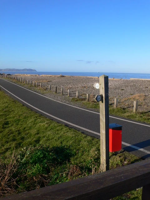 The North Wales Path winding along the coast with stunning mountain and sea views near Bangor.
