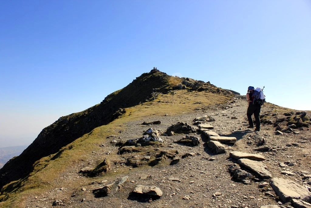 The final slog up Snowdon ridge in Gwynedd, with the summit peak visible in the distance.